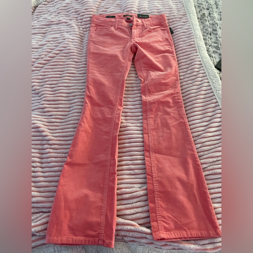 Coral Low rise flare jeans.